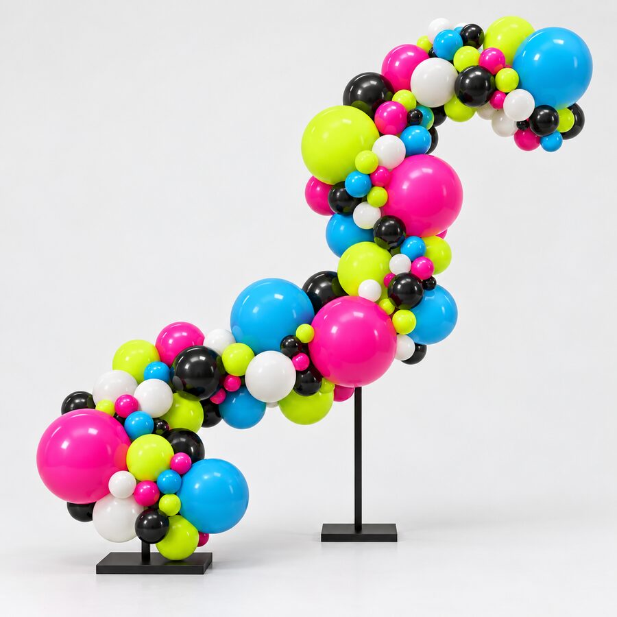 S-shaped sculptural organic balloon installation anchored on two black floor bases.